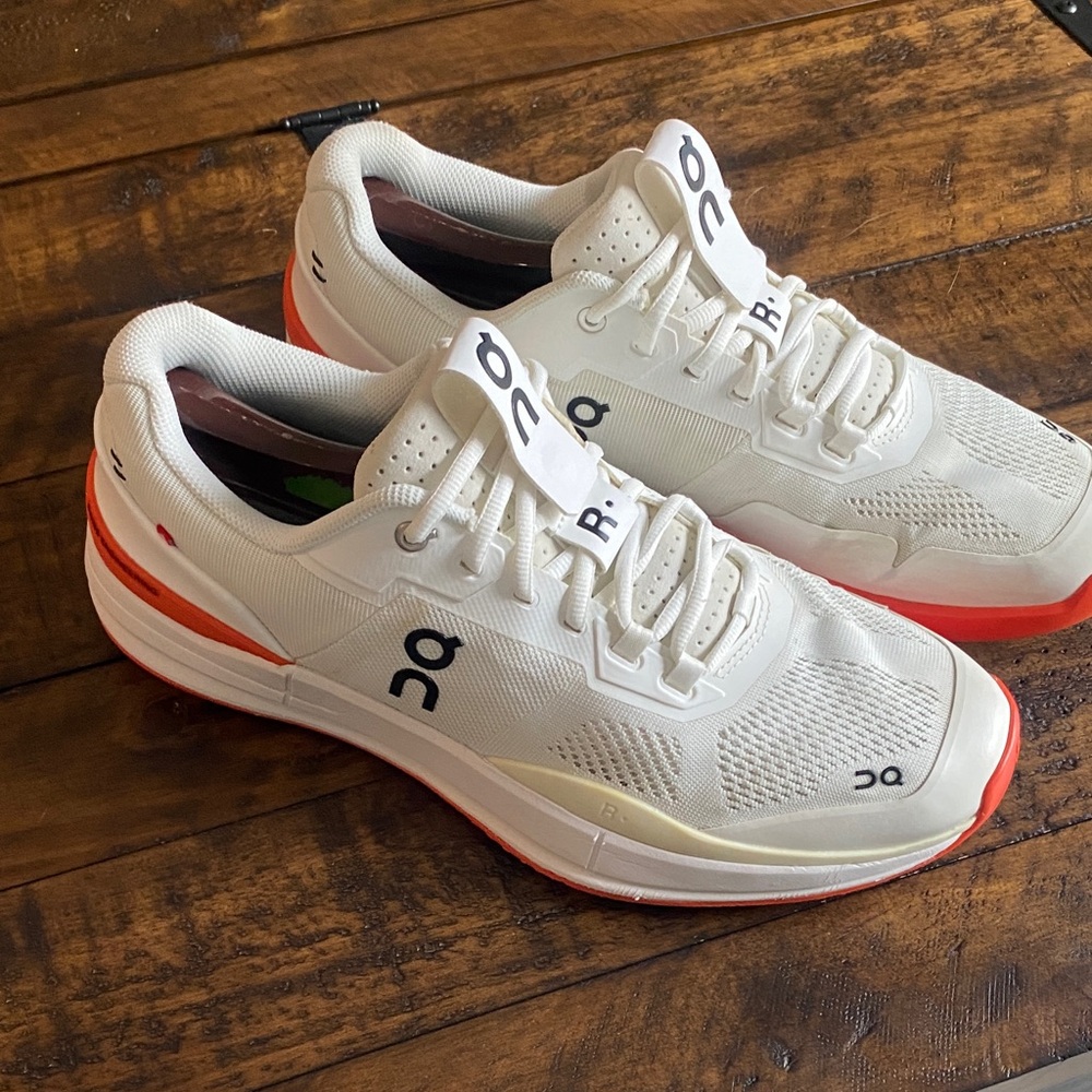 On Running Men's White Athletic Shoes with Orange Accents
